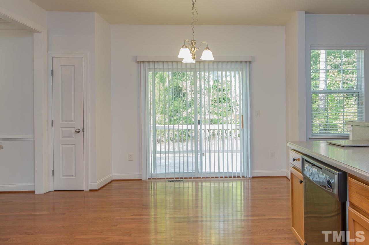 707 Turmeric Lane Durham, NC 27713 - Photo 7 of 18 a view of a room with a chandelier