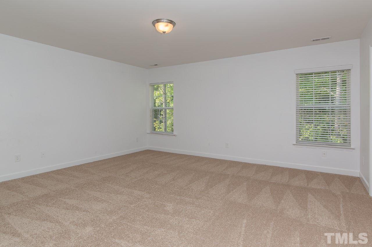 707 Turmeric Lane Durham, NC 27713 - Photo 9 of 18 an empty room with windows