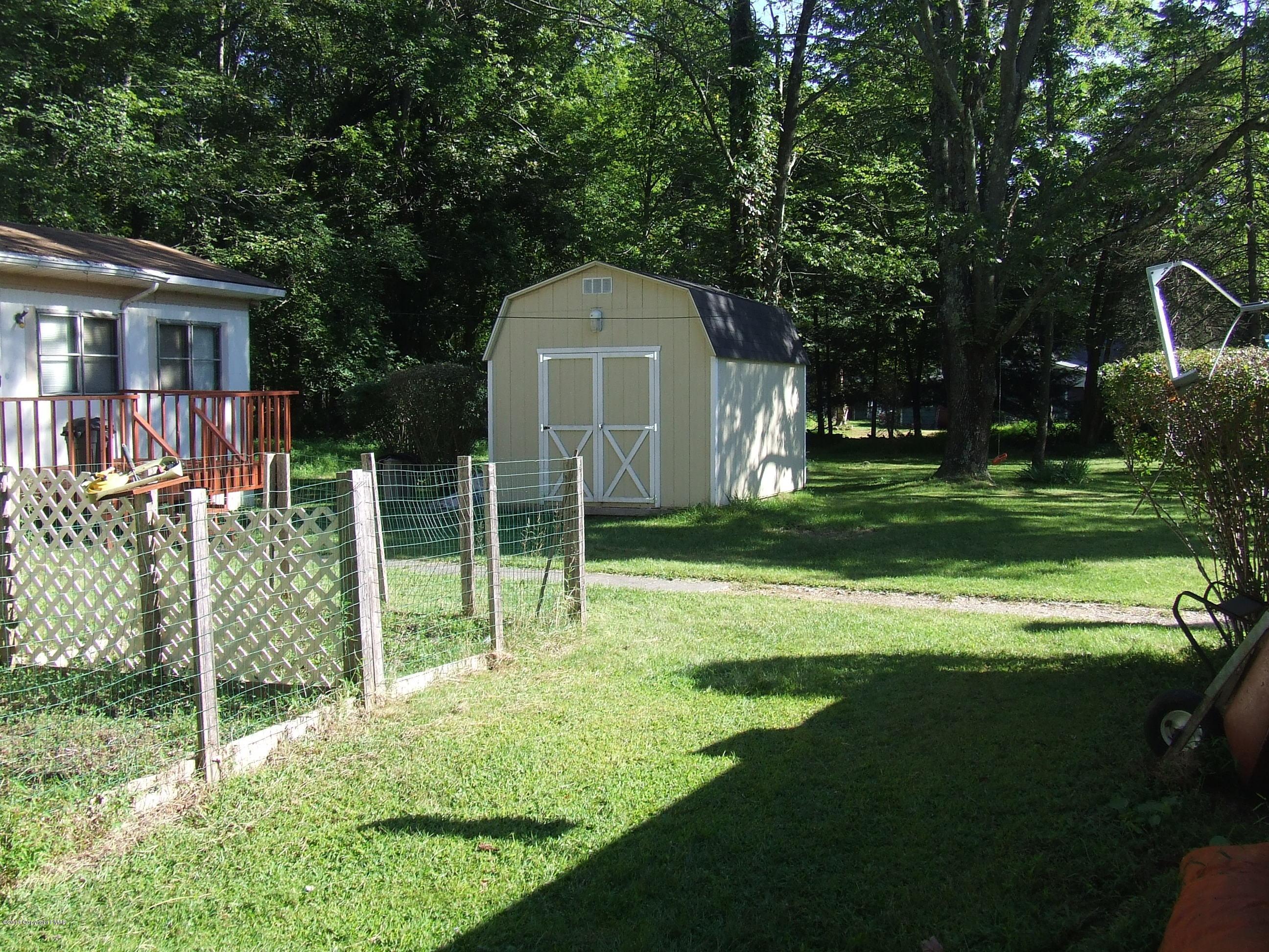 6023 Running Valley Road Stroudsburg, PA 18360 - Photo 13 of 39 a view of a house with backyard and a tree