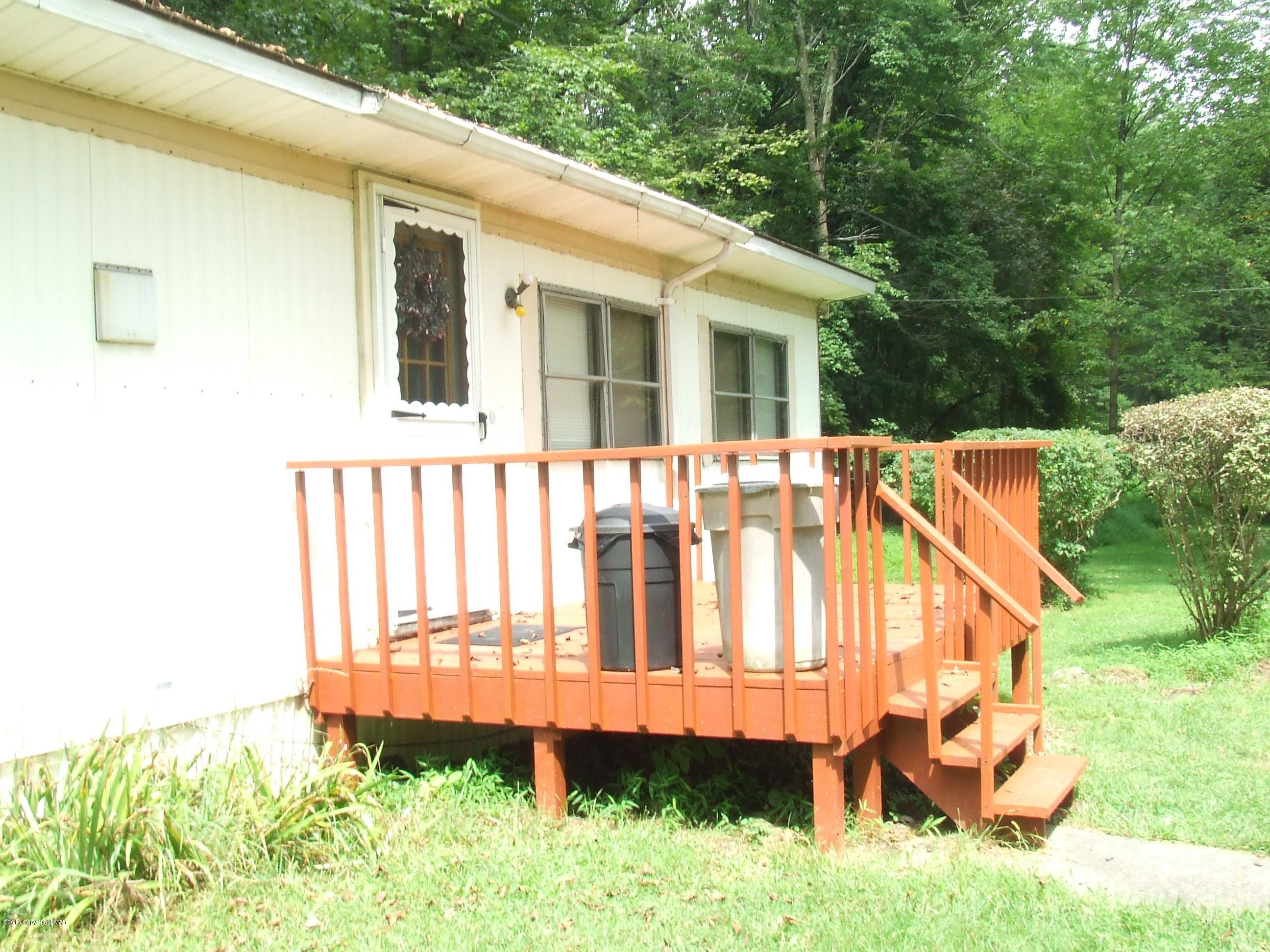 6023 Running Valley Road Stroudsburg, PA 18360 - Photo 15 of 39 a view of a house with a yard