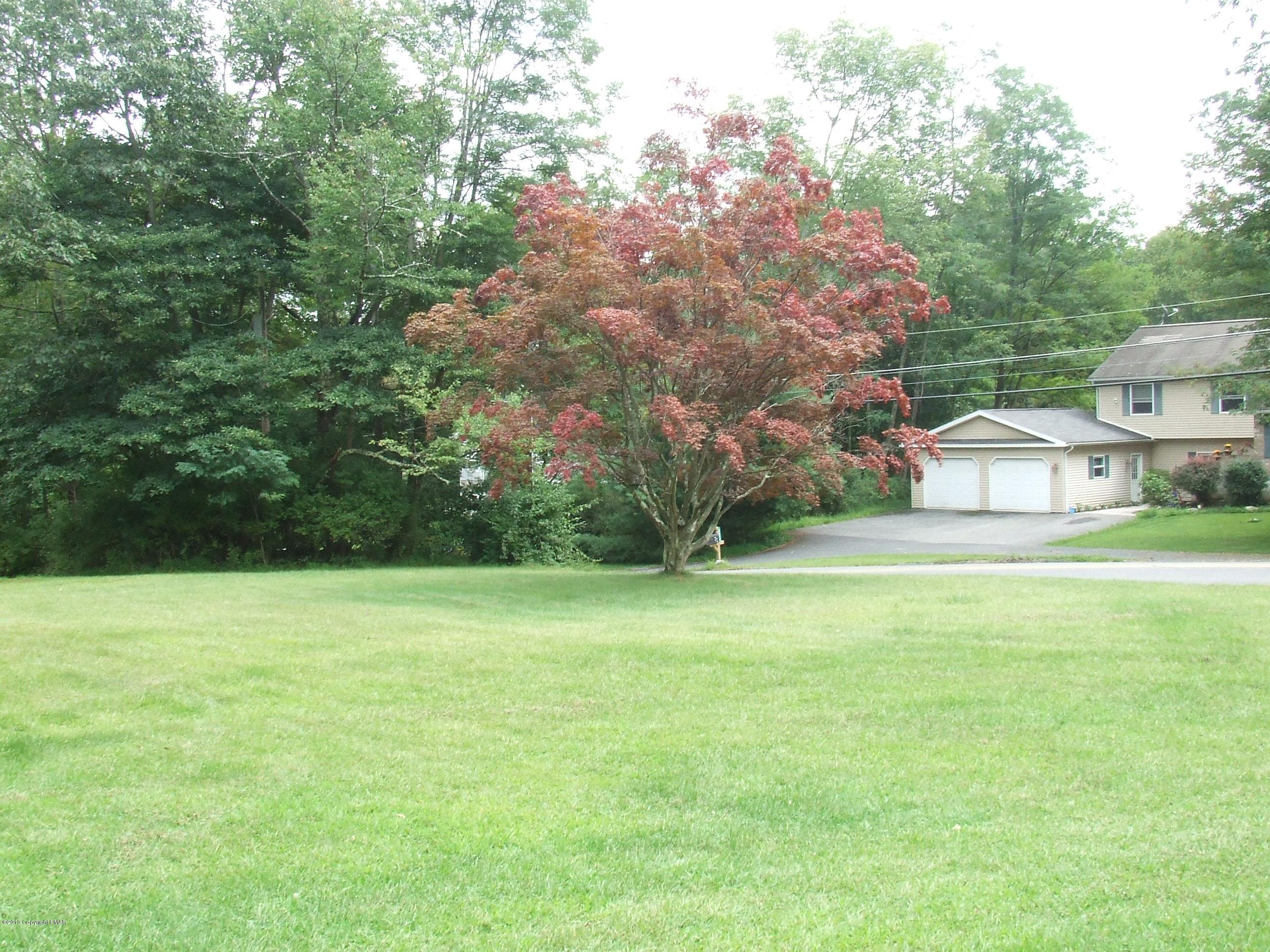 6023 Running Valley Road Stroudsburg, PA 18360 - Photo 22 of 39 a view of a field of grass and trees