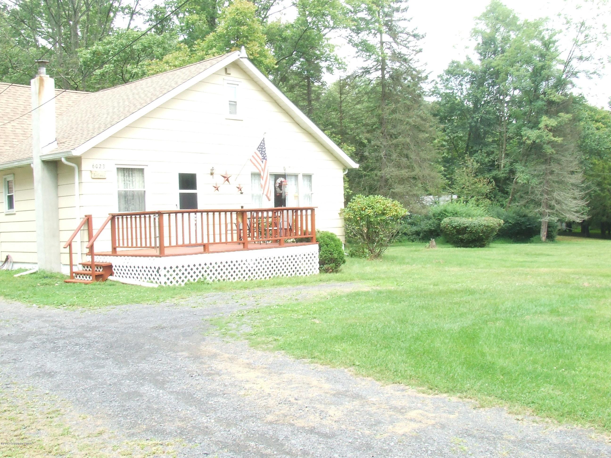 6023 Running Valley Road Stroudsburg, PA 18360 - Photo 23 of 39 a view of a house with backyard and trees