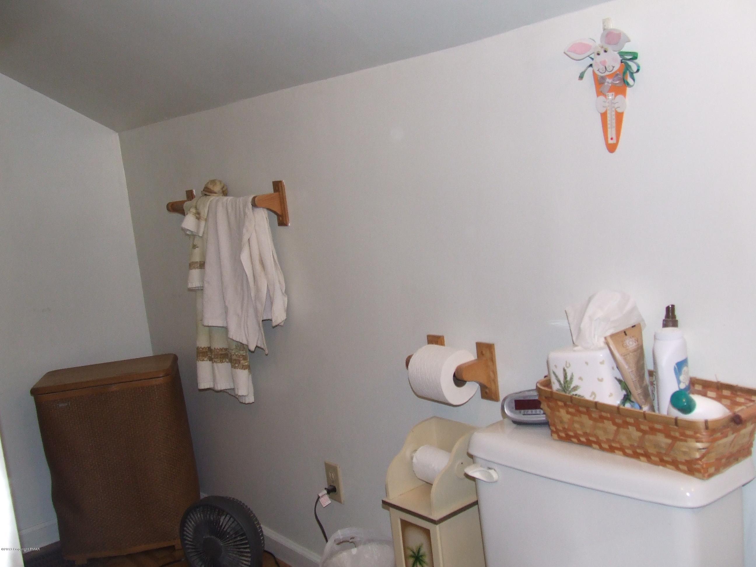 6023 Running Valley Road Stroudsburg, PA 18360 - Photo 30 of 39 a bathroom with a sink toilet and a mirror