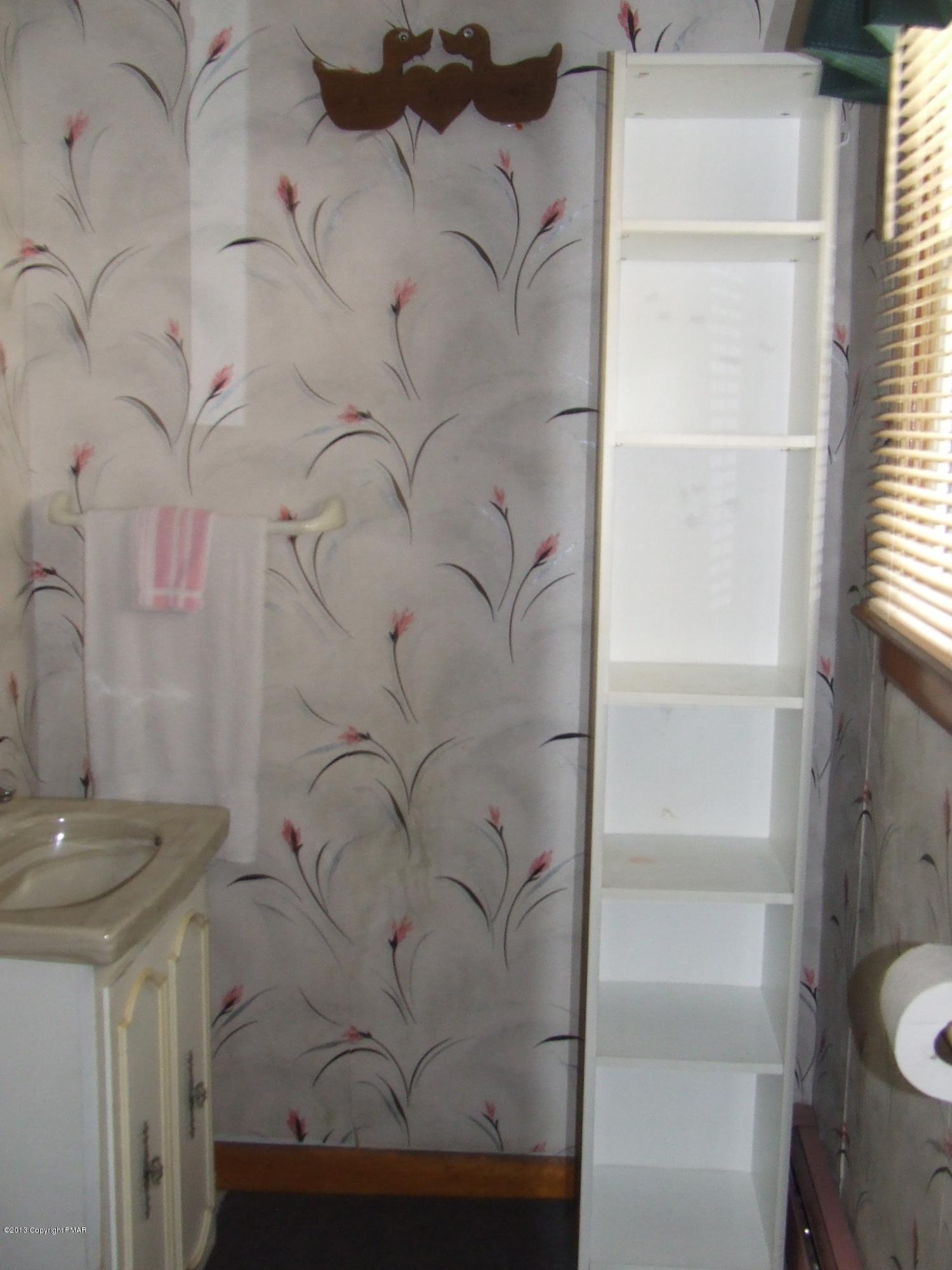 6023 Running Valley Road Stroudsburg, PA 18360 - Photo 39 of 39 a bathroom with a sink and a toilet