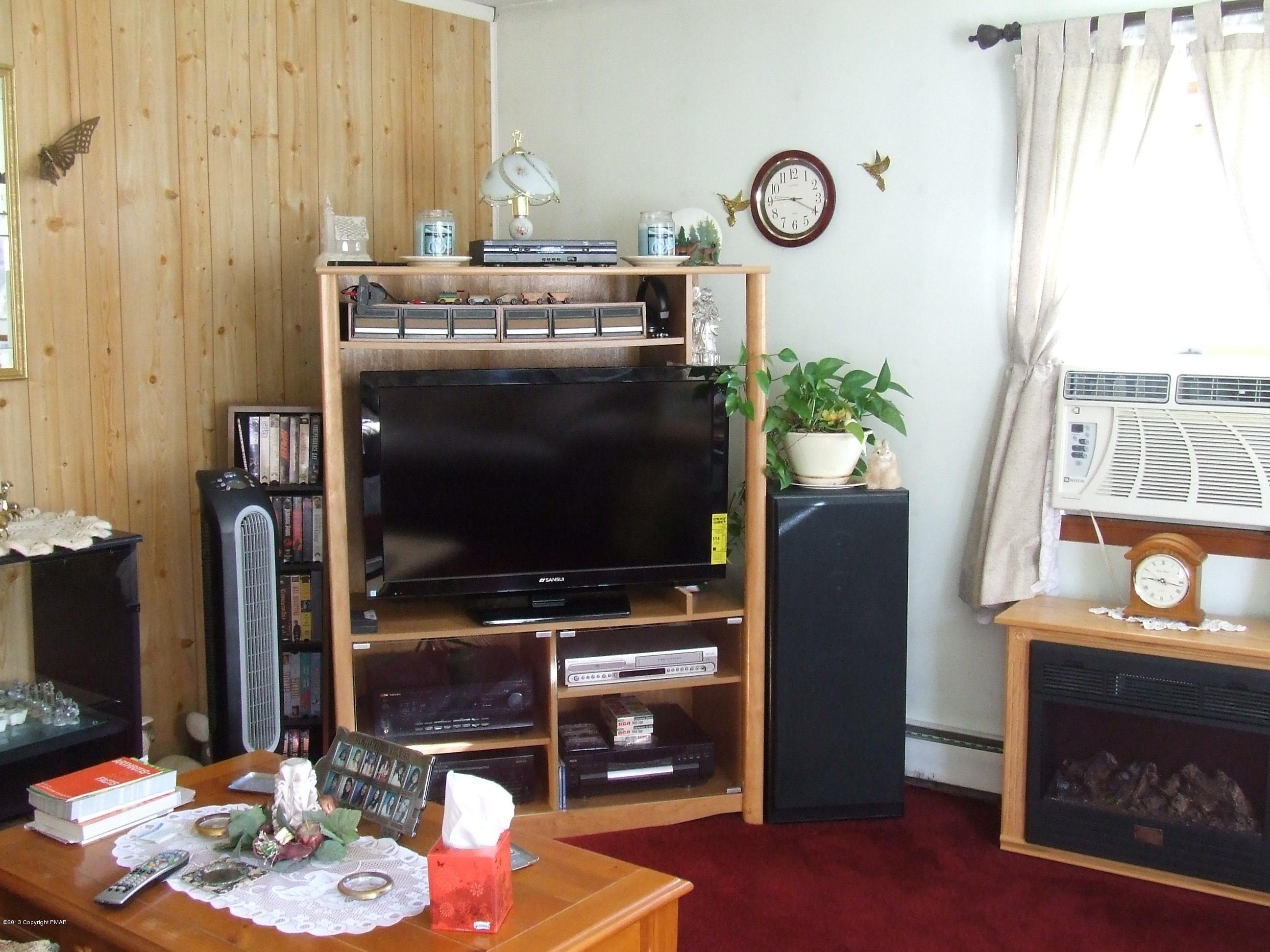 6023 Running Valley Road Stroudsburg, PA 18360 - Photo 4 of 39 a living room with furniture and a flat screen tv