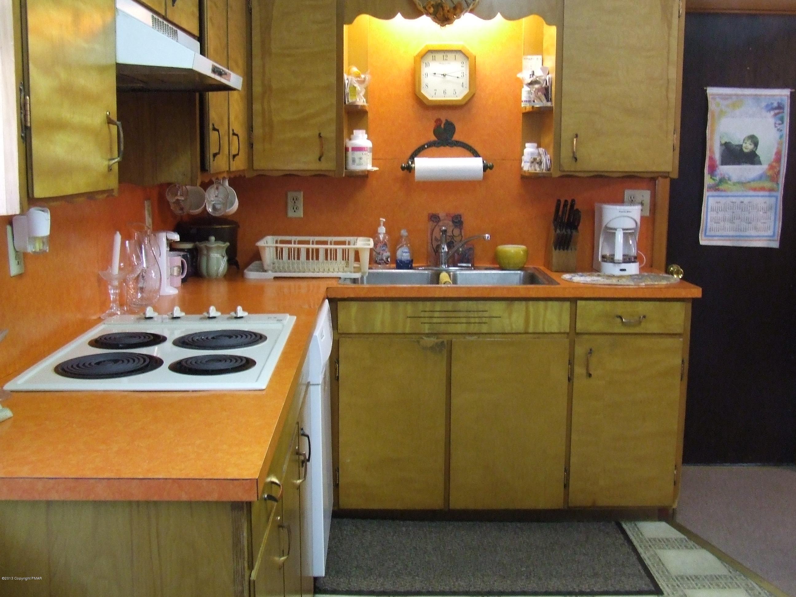 6023 Running Valley Road Stroudsburg, PA 18360 - Photo 8 of 39 a kitchen with counter top space and stove top oven