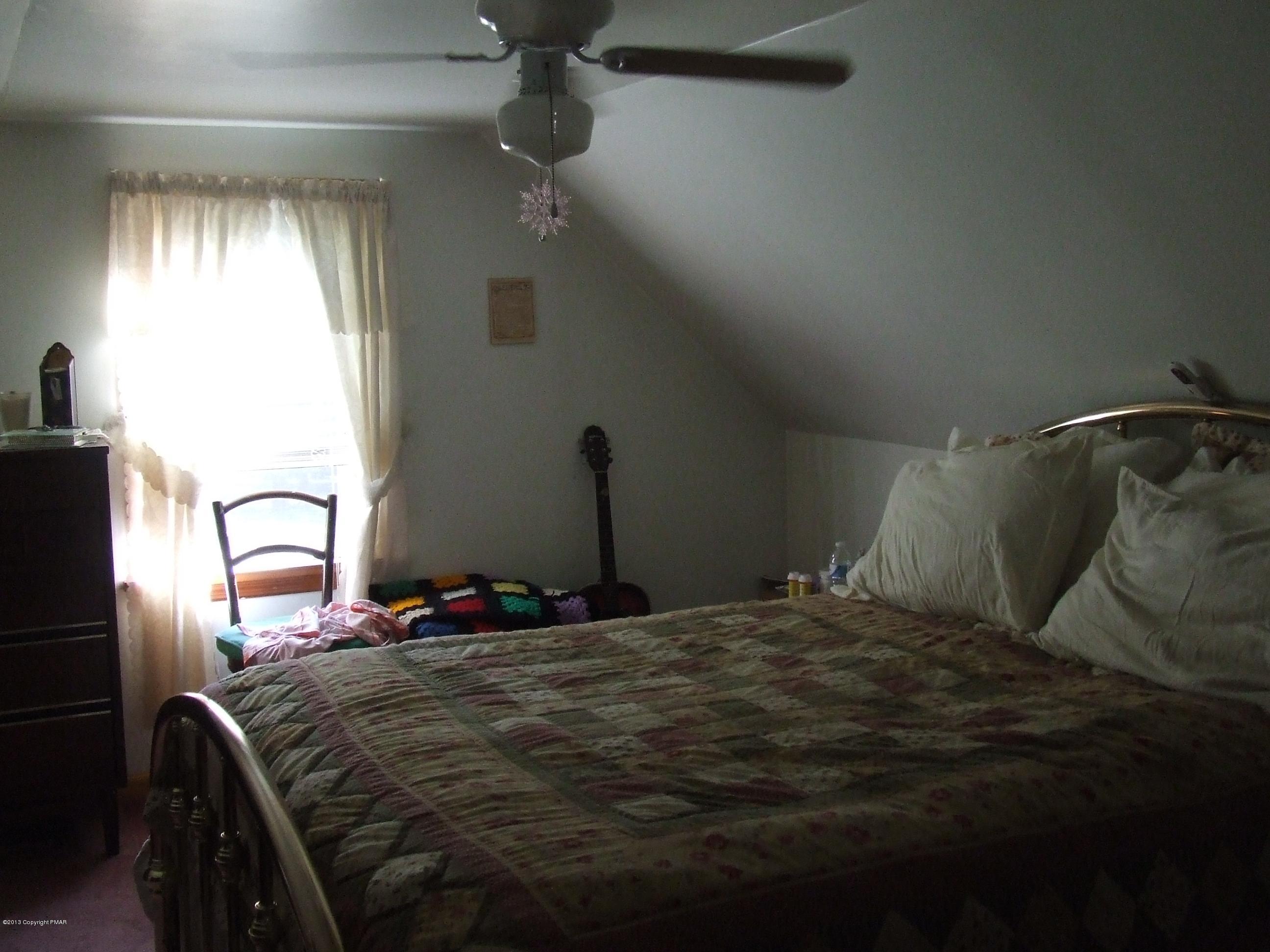 6023 Running Valley Road Stroudsburg, PA 18360 - Photo 9 of 39 a bedroom with a bed and a large mirror