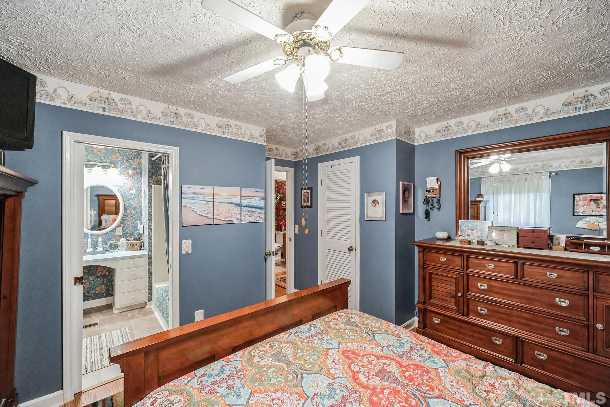 620 Long Avenue Roxboro, NC 27573 - Photo 12 of 39 a bedroom with a bed and a dresser