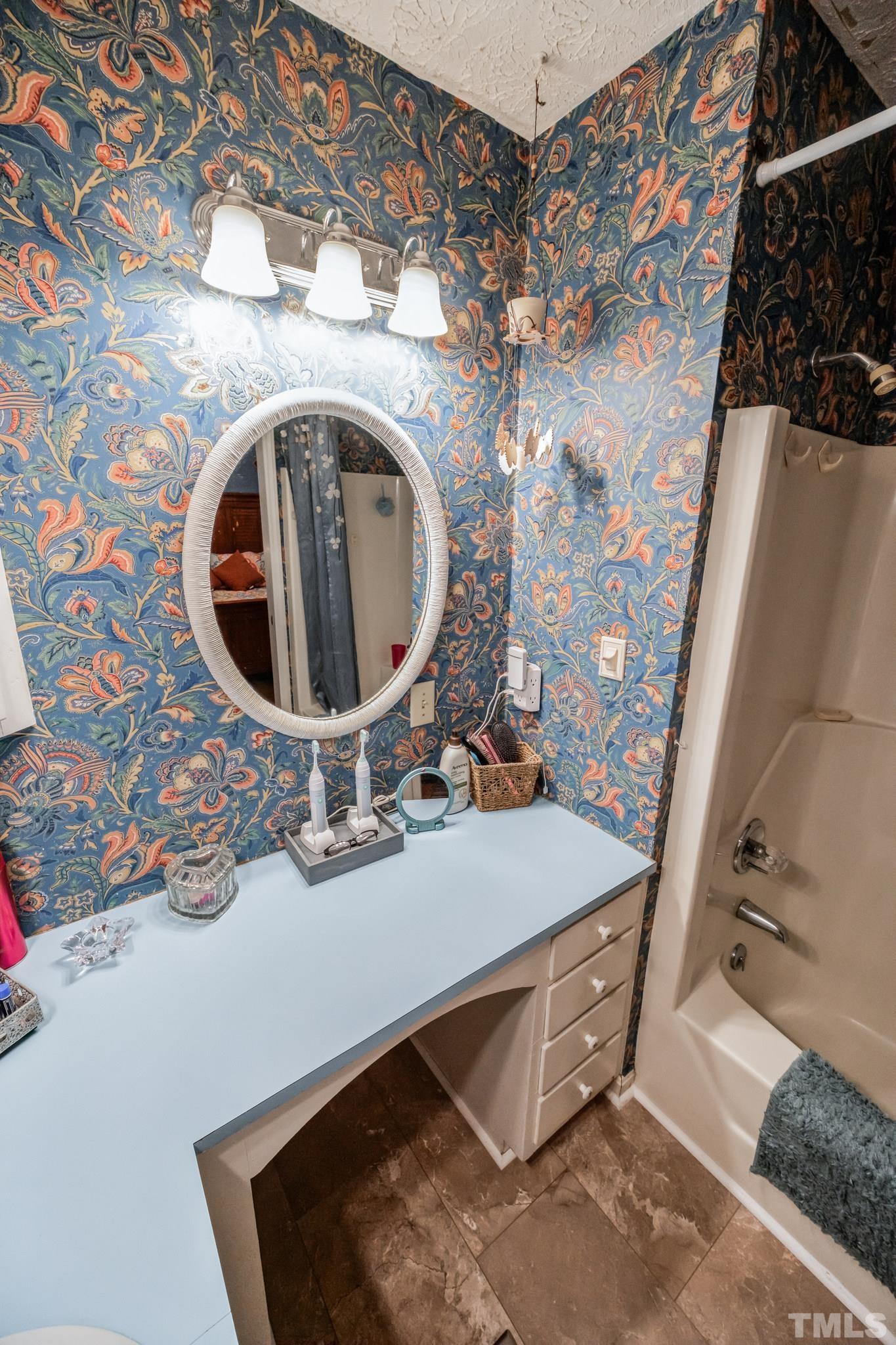 620 Long Avenue Roxboro, NC 27573 - Photo 14 of 39 a bathroom with a sink and mirror