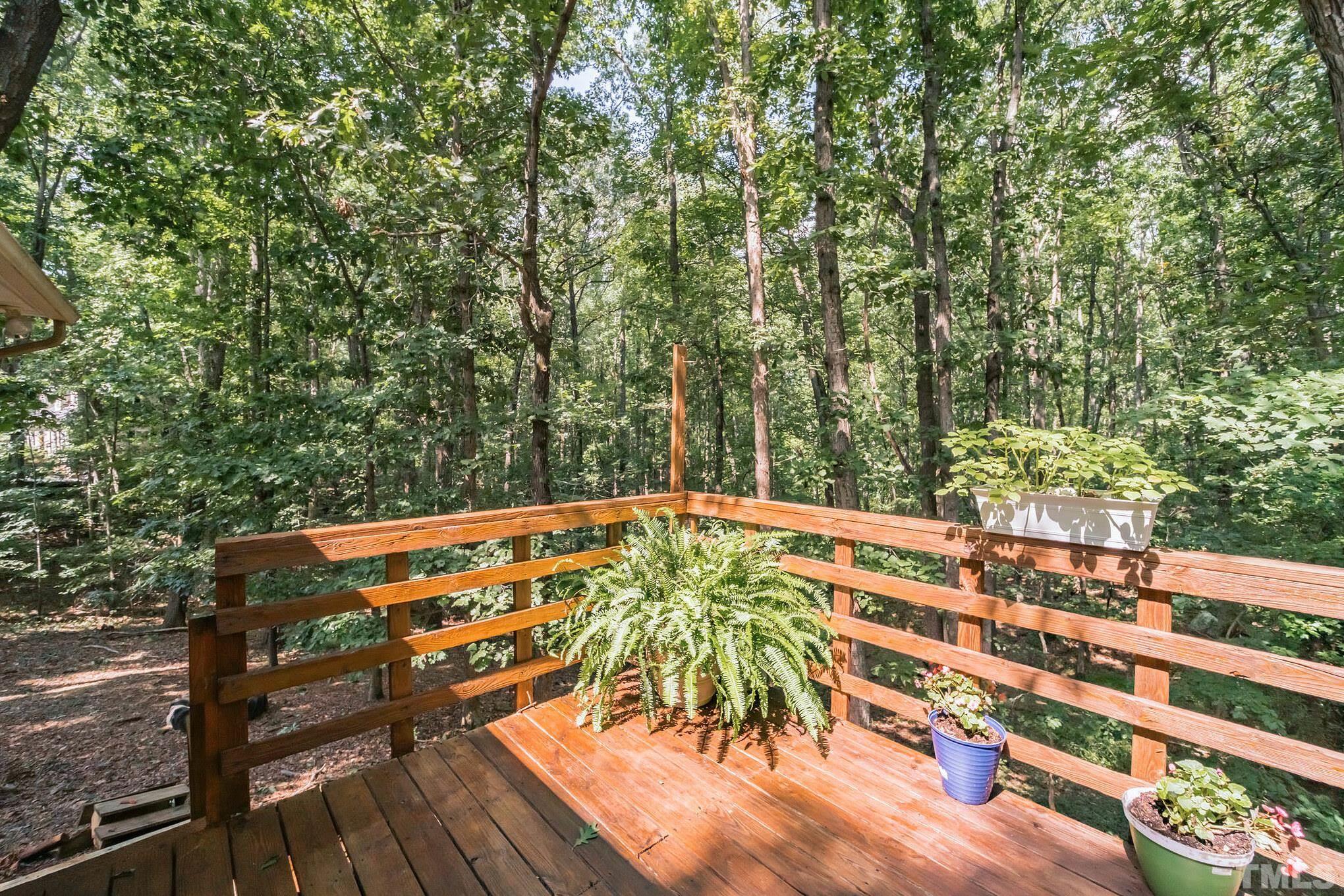 620 Long Avenue Roxboro, NC 27573 - Photo 23 of 39 a view of a chairs and table on the wooden deck
