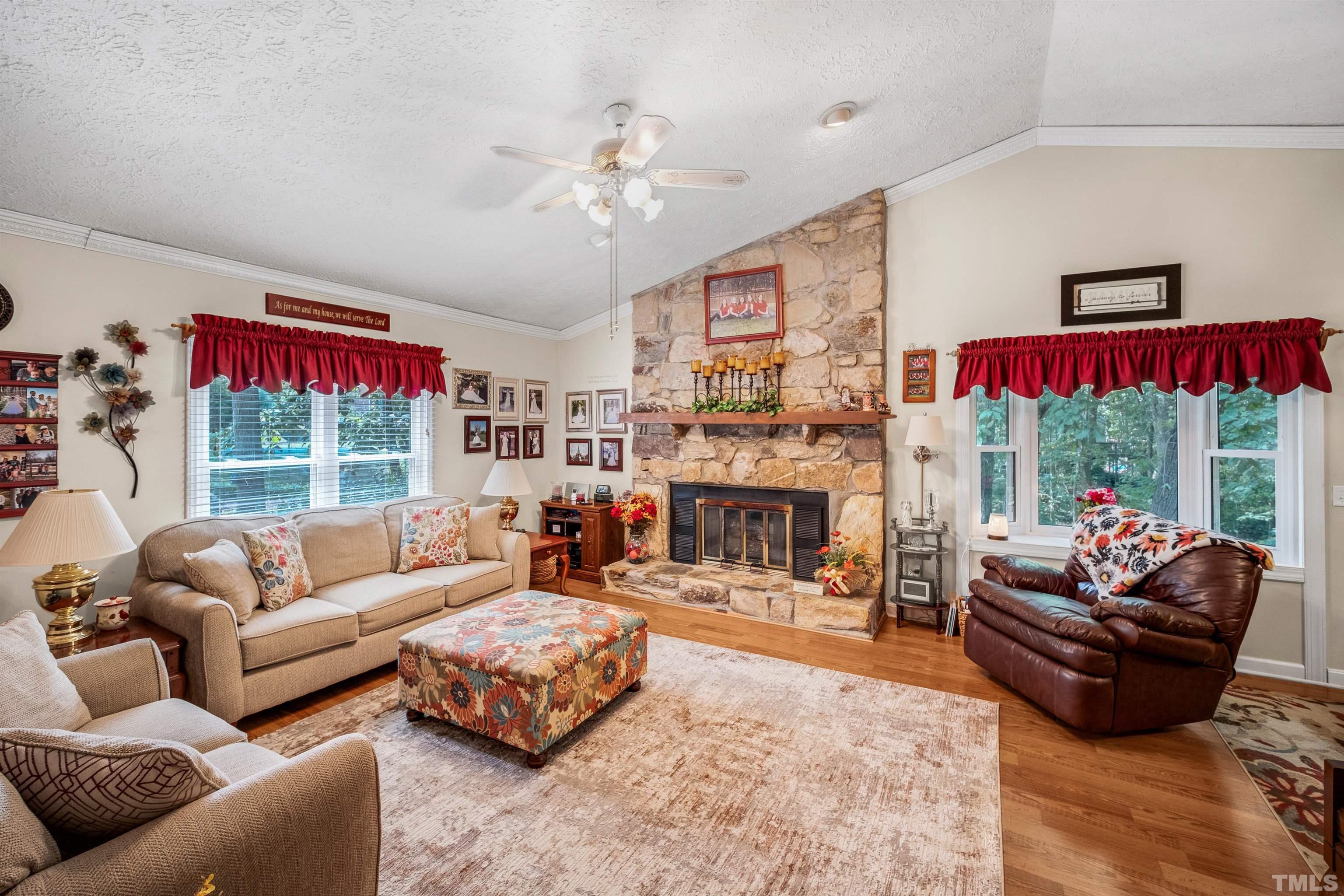 620 Long Avenue Roxboro, NC 27573 - Photo 3 of 39 a living room with furniture large window and fireplace