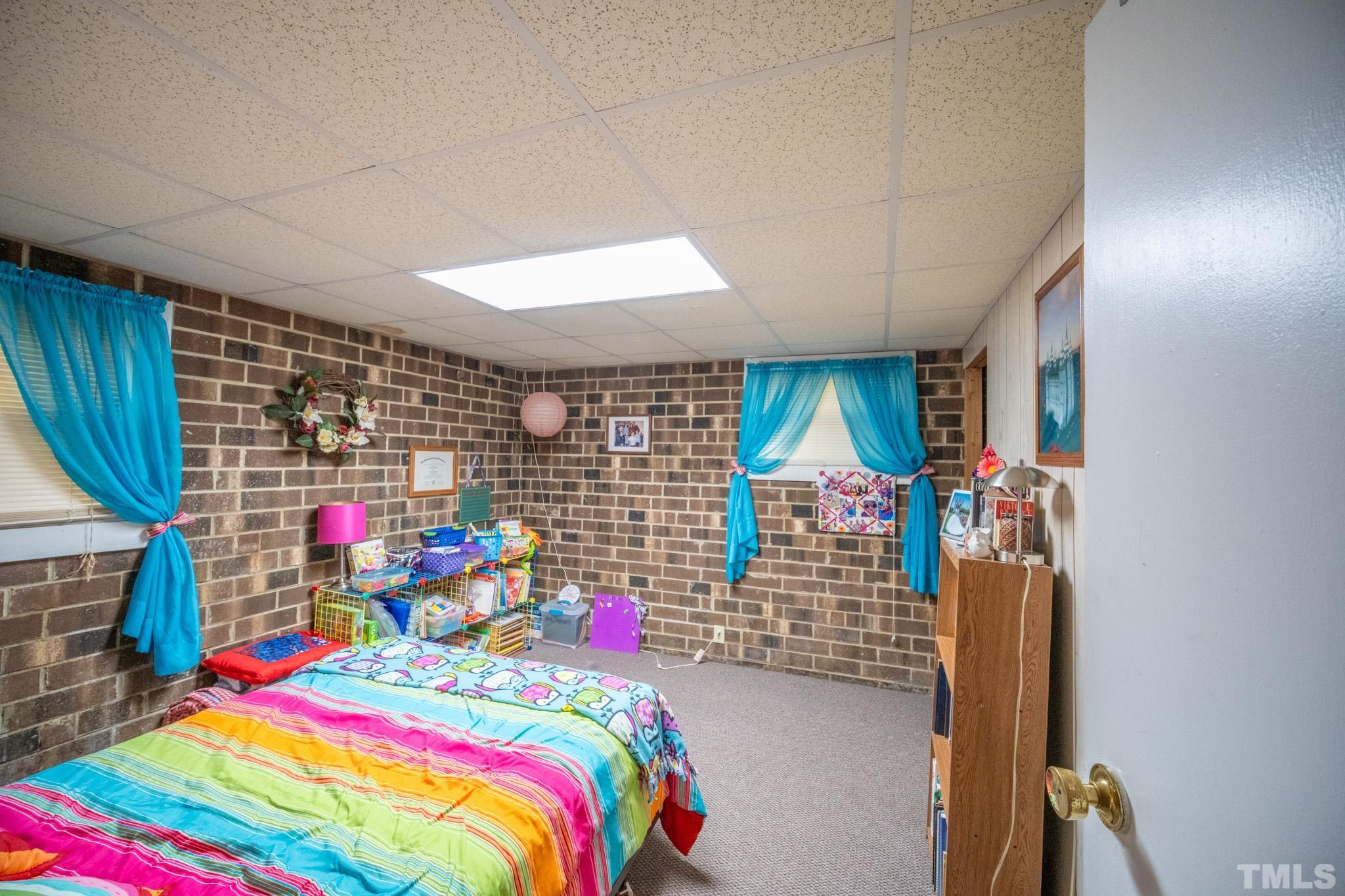 620 Long Avenue Roxboro, NC 27573 - Photo 32 of 39 a room that has a bed and a table chair
