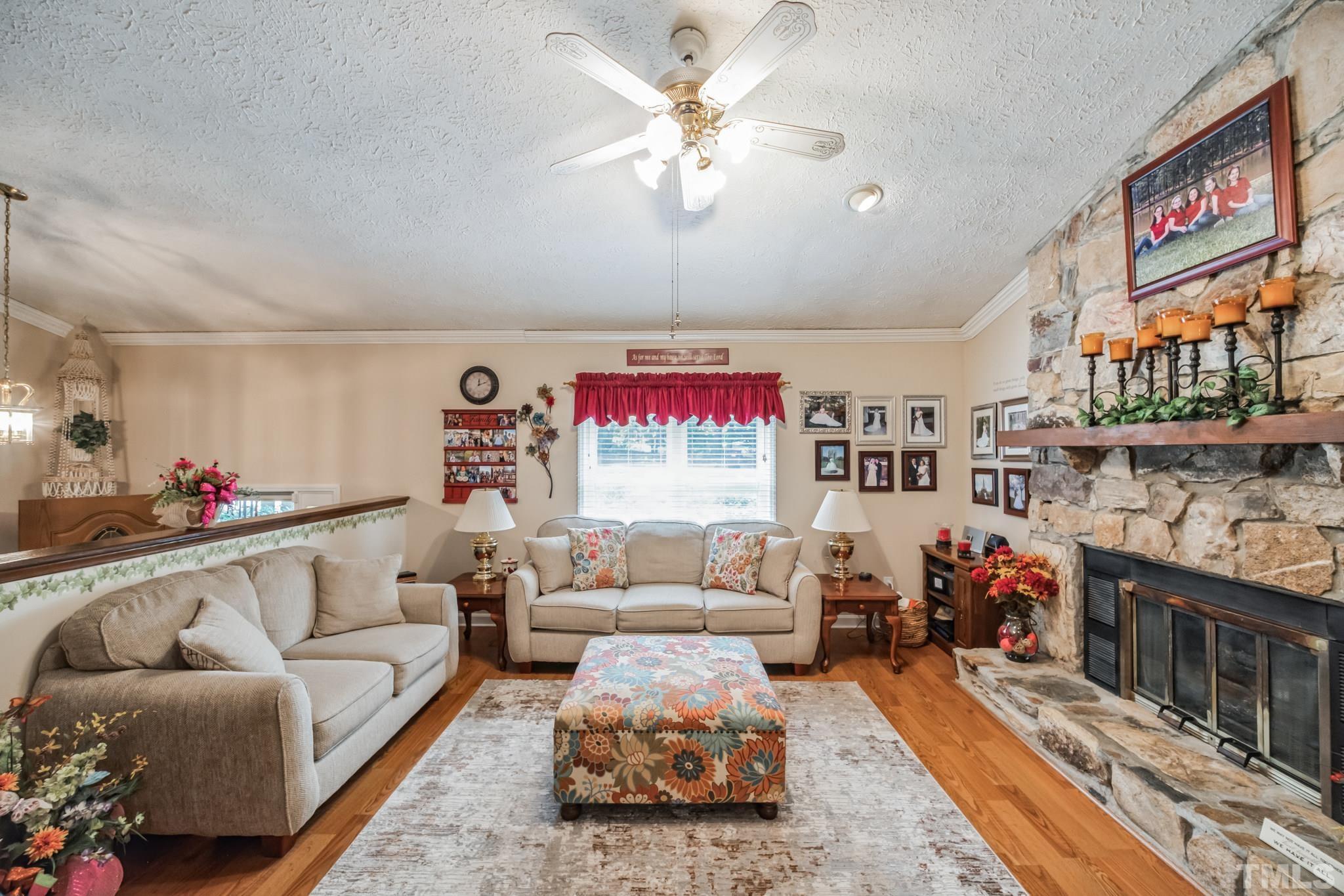 620 Long Avenue Roxboro, NC 27573 - Photo 4 of 39 a living room with furniture and a bookshelf