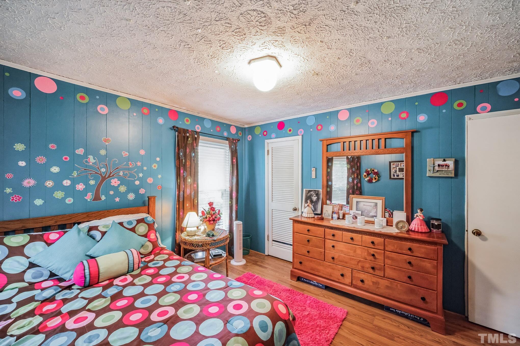 620 Long Avenue Roxboro, NC 27573 - Photo 9 of 39 a bedroom with furniture and a baby crib