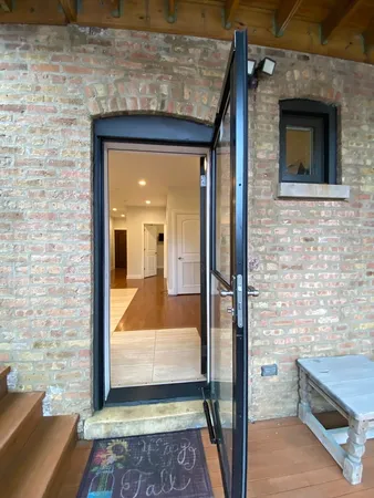 a view of a door and wooden floor