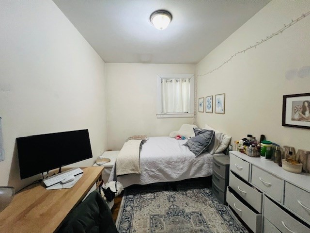 51 Calumet Street, Unit 1 Boston, MA 02120 - Photo 2 of 7 a bedroom with a bed and a window