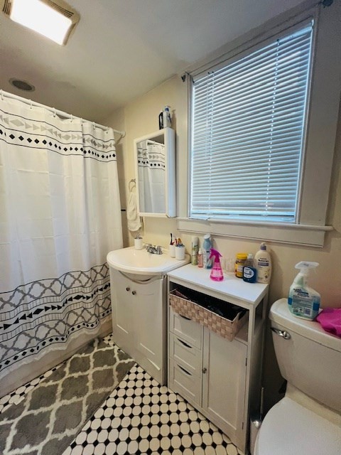 51 Calumet Street, Unit 1 Boston, MA 02120 - Photo 3 of 7 a bathroom with a sink toilet vanity and shower