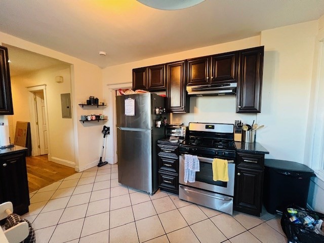 51 Calumet Street, Unit 1 Boston, MA 02120 - Photo 6 of 7 a kitchen with stainless steel appliances granite countertop a refrigerator and a stove