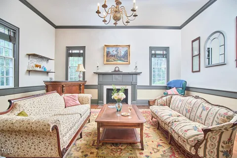 a bedroom with a bed and a fireplace