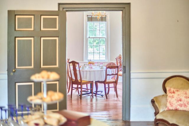 a living room with furniture a rug and a window