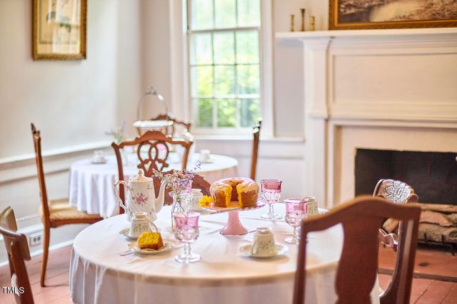 a bedroom with furniture and a wooden floor