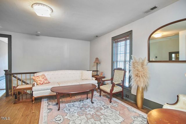 a house with trees in the background