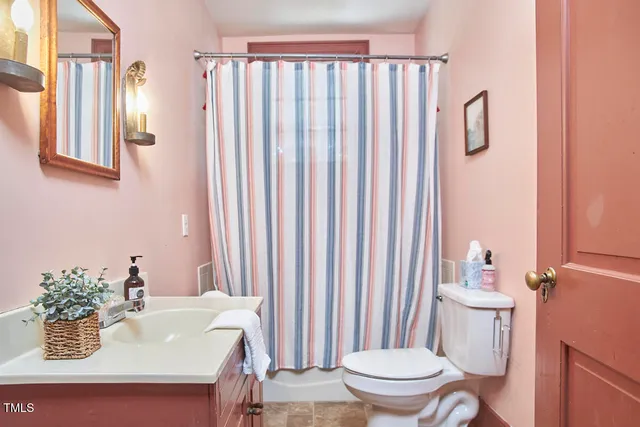 a view of a park with large trees