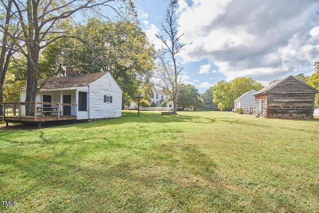 a dining room with furniture a flat screen tv and outdoor view