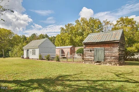 a view of swimming pool and trees in the background