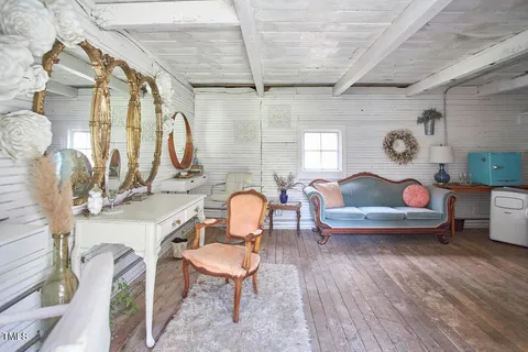a view of a swimming pool with a house in the background