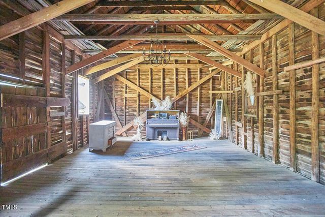an aerial view of a house with yard