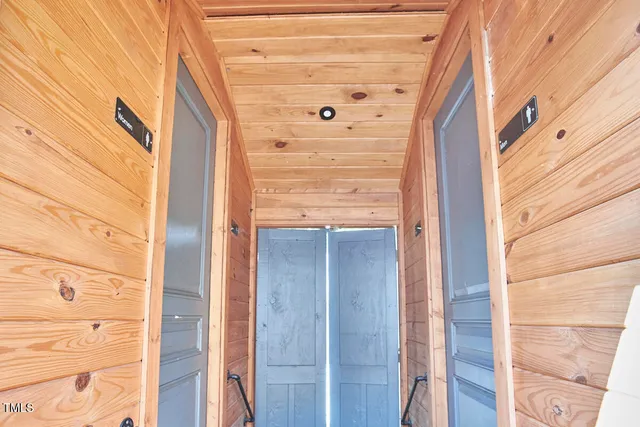 an aerial view of a house with a garden and trees