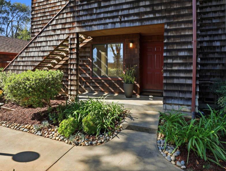 1555 Hecker Pass Road, Unit H102 Gilroy, CA 95020 - Photo 1 of 34 a front view of a house with a yard