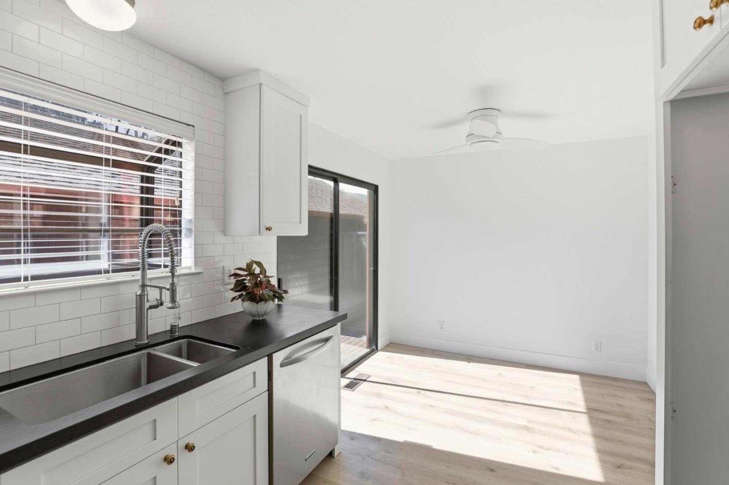 1555 Hecker Pass Road, Unit H102 Gilroy, CA 95020 - Photo 16 of 34 a kitchen with a sink and large window