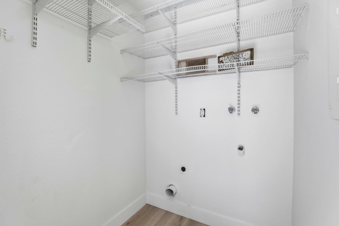 1555 Hecker Pass Road, Unit H102 Gilroy, CA 95020 - Photo 19 of 34 a view of a room with racks on the wall