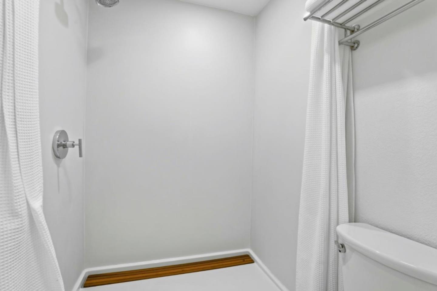 1555 Hecker Pass Road, Unit H102 Gilroy, CA 95020 - Photo 20 of 34 a bathroom with a shower