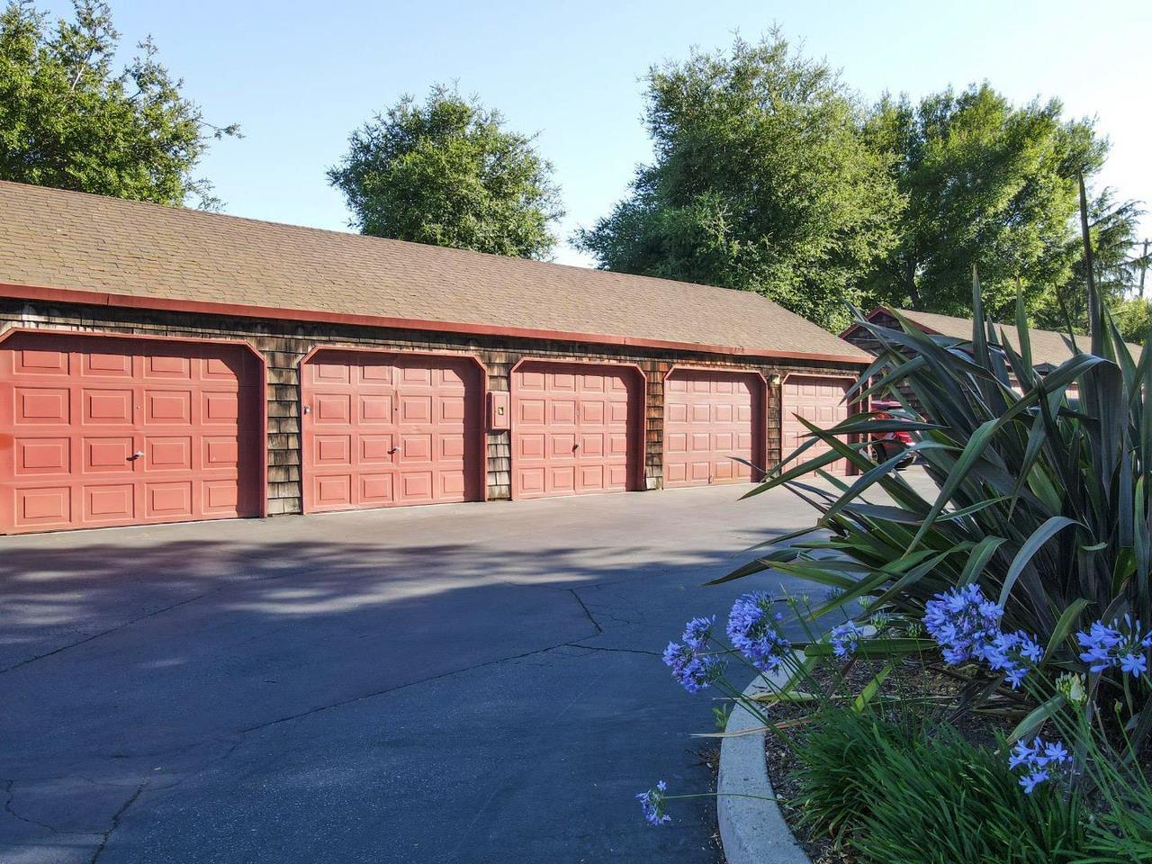 1555 Hecker Pass Road, Unit H102 Gilroy, CA 95020 - Photo 28 of 34 a flower garden is sitting in front of a house