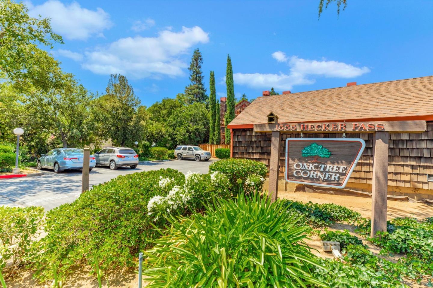 1555 Hecker Pass Road, Unit H102 Gilroy, CA 95020 - Photo 34 of 34 a front view of a building with garden