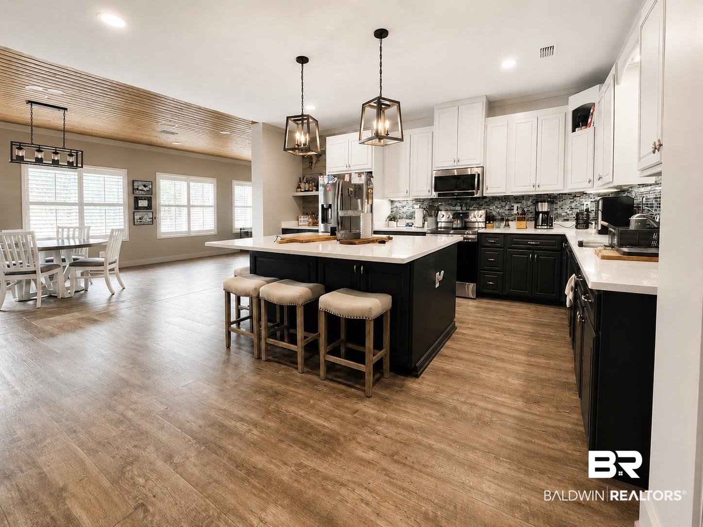 9825 Wolf Creek Ridge Elberta, AL 36530 - Photo 37 of 76 Open-concept kitchen and dining area featuring wood-finish flooring