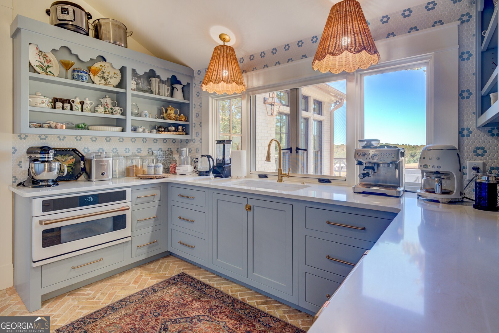 419 Parker Road McDonough, GA 30252 - Photo 40 of 115 a kitchen with stainless steel appliances granite countertop a sink and cabinets