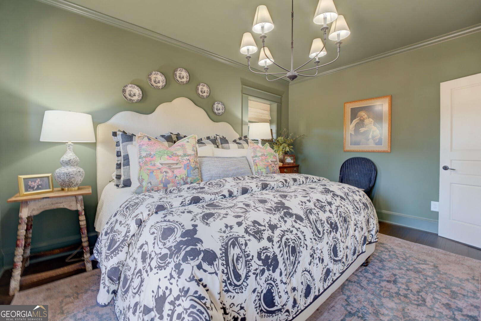 419 Parker Road McDonough, GA 30252 - Photo 70 of 115 a bedroom with a bed and a chandelier