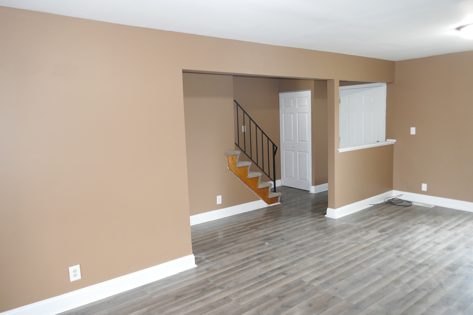 412 Salem Square Bolingbrook, IL 60440 - Photo 2 of 20 a view of an empty room with wooden floor and stairs