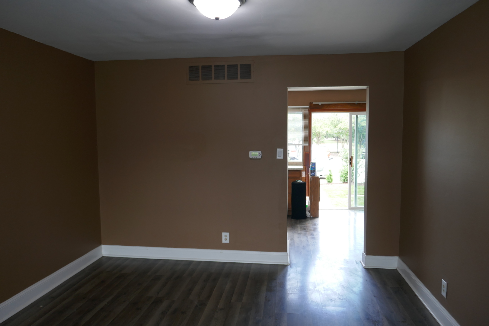 412 Salem Square Bolingbrook, IL 60440 - Photo 4 of 20 an empty room with wooden floor and a window