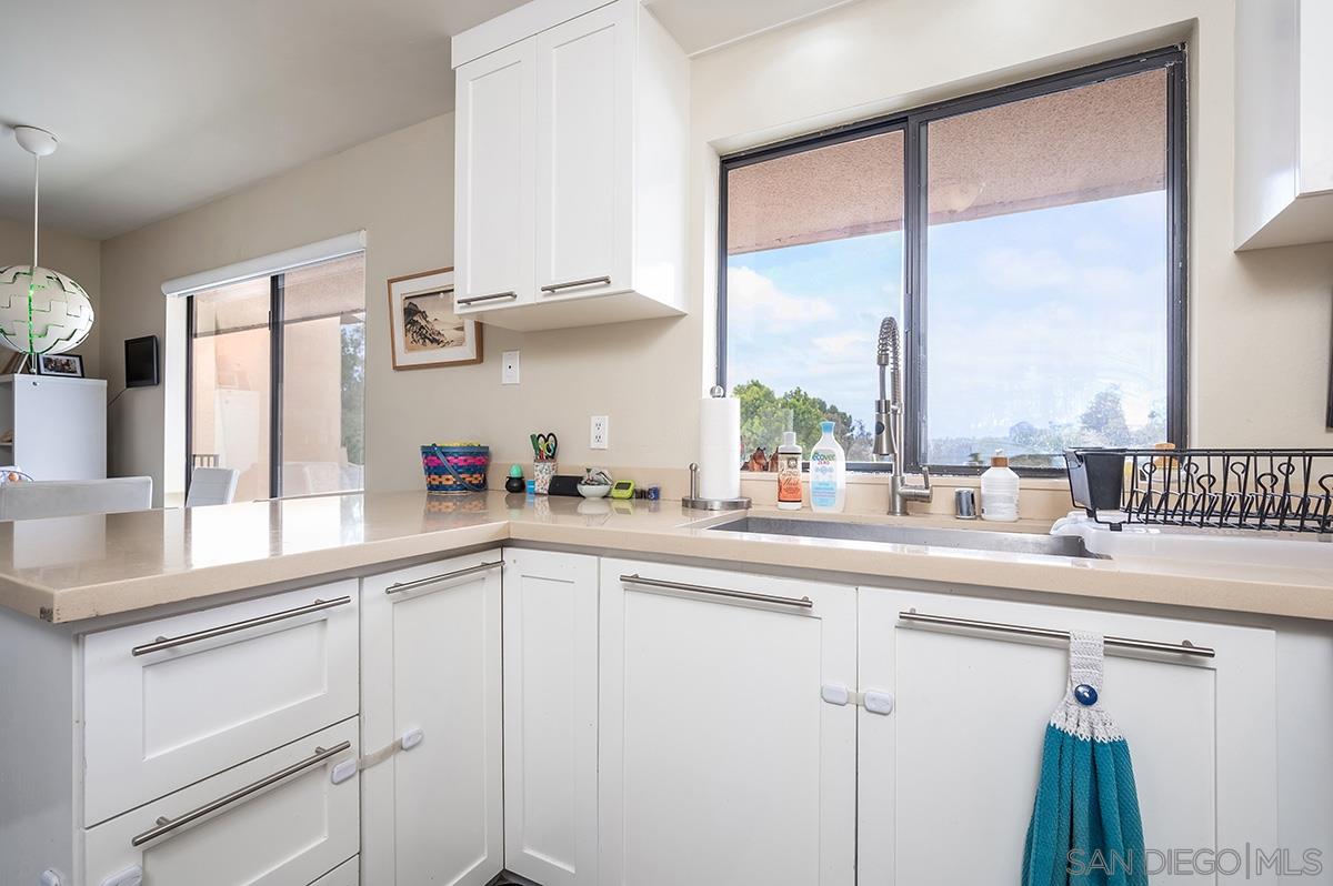 4266 Sixth Avenue San Diego, CA 92103 - Photo 12 of 29 a kitchen with appliances cabinets and a large window