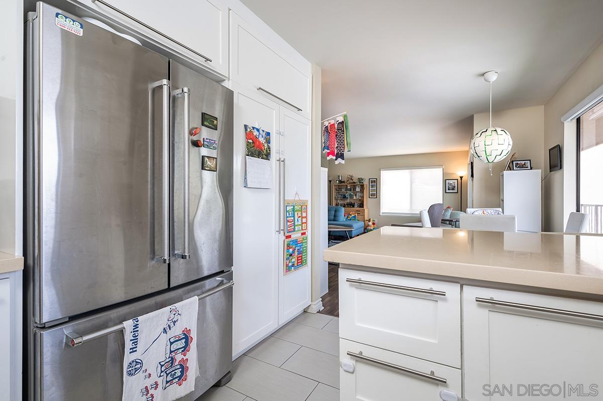 4266 Sixth Avenue San Diego, CA 92103 - Photo 14 of 29 a kitchen with stainless steel appliances granite countertop a refrigerator and a sink
