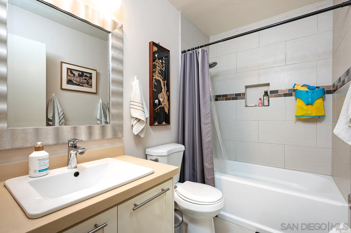 4266 Sixth Avenue San Diego, CA 92103 - Photo 15 of 29 a bathroom with a sink mirror toilet and bathtub