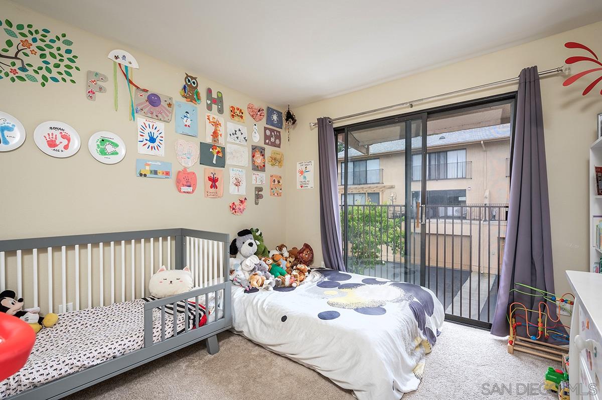 4266 Sixth Avenue San Diego, CA 92103 - Photo 16 of 29 a bedroom with a bed and a window