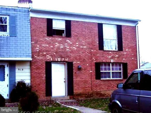 820 Anvil Road Fredericksburg, VA 22405 - Photo 1 of 10 a front view of a house with a yard