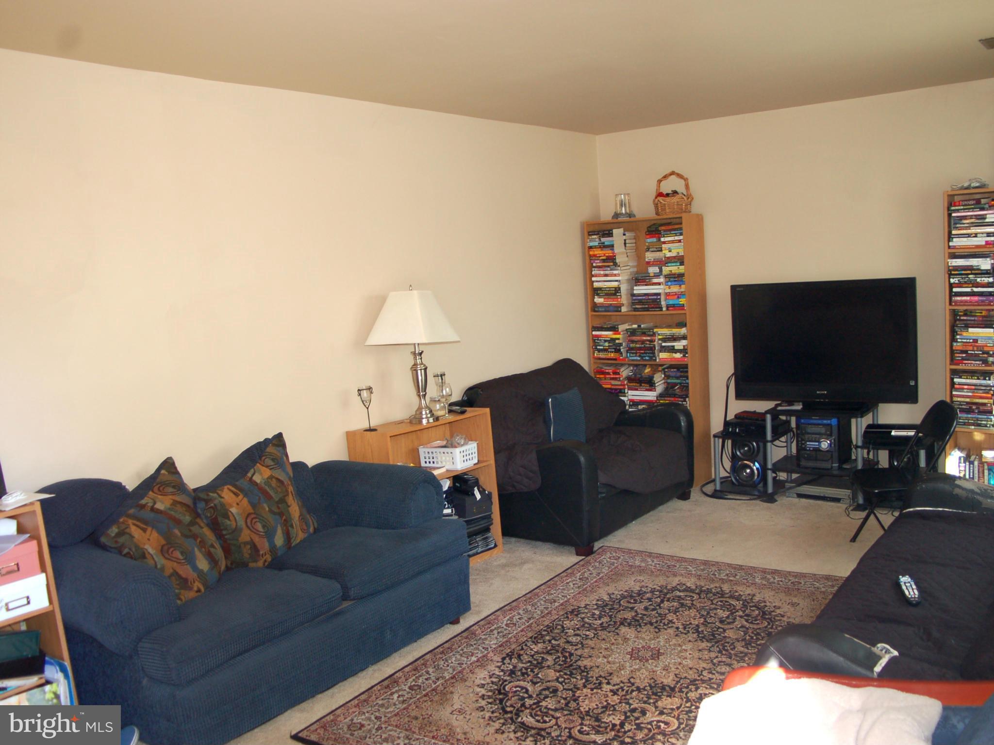 820 Anvil Road Fredericksburg, VA 22405 - Photo 4 of 10 a living room with furniture and a flat screen tv