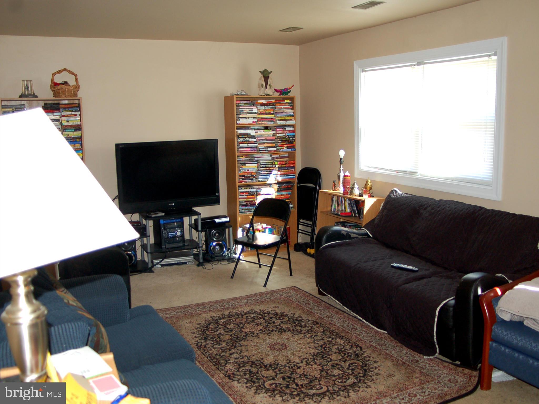 820 Anvil Road Fredericksburg, VA 22405 - Photo 5 of 10 a living room with furniture and a flat screen tv